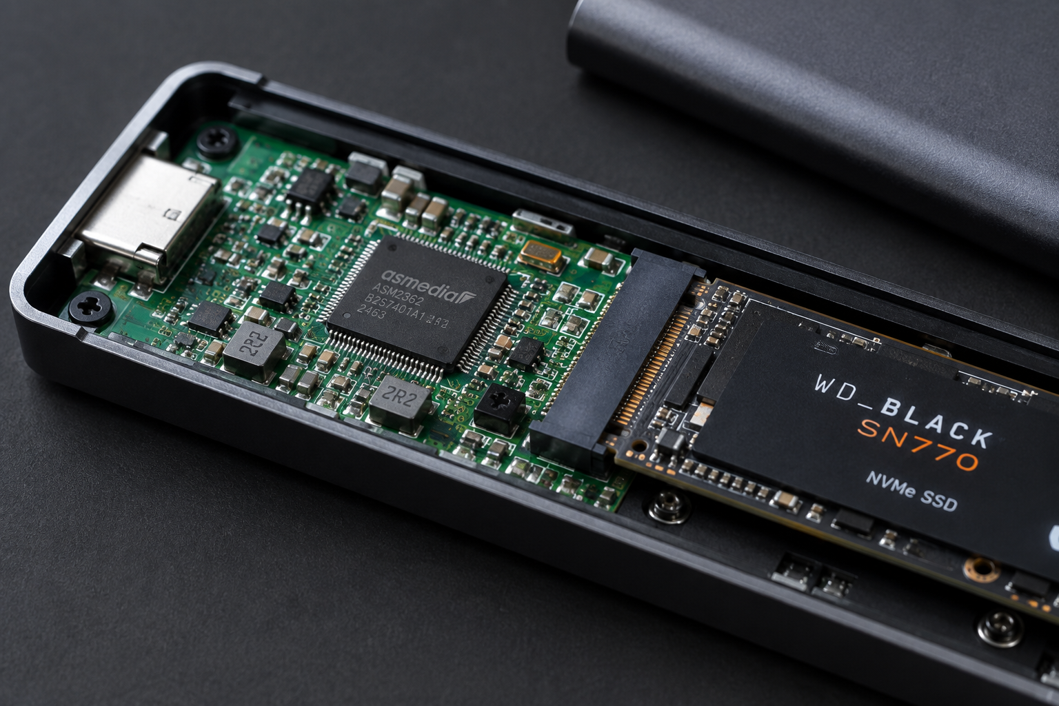 Close-up of an NVMe enclosure's internal circuit board showing the bridge controller chip