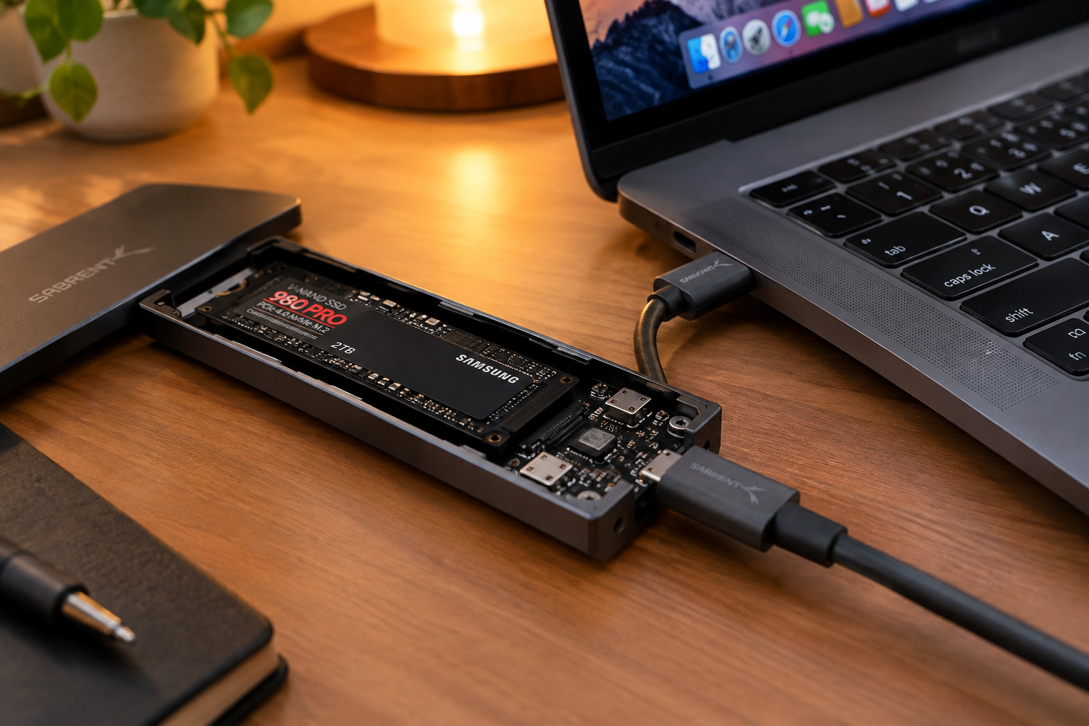 External NVMe SSD enclosure with USB-C cable connected on a desk near a laptop